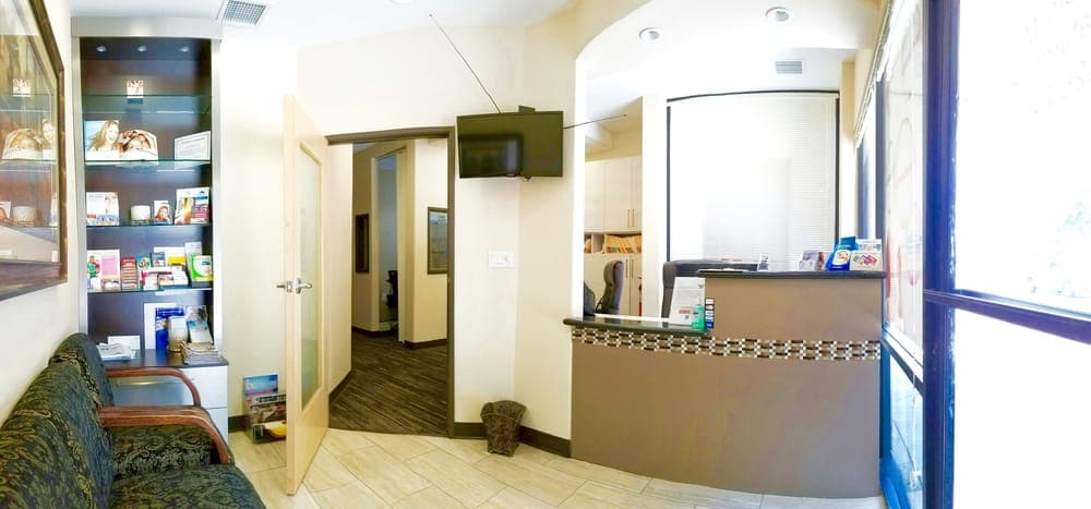 Comfortable waiting area at Allure Dental Arts with seating and natural light